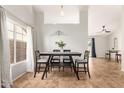 Bright dining room features a modern table and chairs, tile flooring, and plenty of natural light at 1381 W Gary Dr, Chandler, AZ 85224