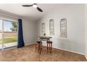 Cozy living area with a ceiling fan, sliding glass doors to the backyard, and decorative wall art at 1381 W Gary Dr, Chandler, AZ 85224