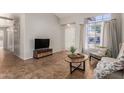 Inviting living room with tile floors, a large window, and neutral wall colors offering versatile decor options at 1381 W Gary Dr, Chandler, AZ 85224