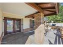 Inviting front porch area with seating and decorative brickwork, providing a cozy outdoor space at 14221 N 43Rd St, Phoenix, AZ 85032