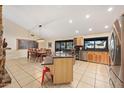 Spacious kitchen featuring a center island, stainless steel appliances, and ample cabinet space at 14221 N 43Rd St, Phoenix, AZ 85032