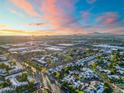 Breathtaking aerial view of a city landscape at sunset, highlighting the beautiful skyline and mountain backdrop at 1913 S River Dr, Tempe, AZ 85281