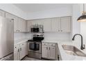Kitchen featuring stainless steel appliances, modern countertops, and bright overhead lighting at 20100 N 78Th Pl # 2114, Scottsdale, AZ 85255