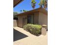 View of the home's exterior showing private entrance and well maintained landscaping at 20332 N Denizen Dr, Surprise, AZ 85387