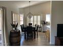 Dining area with chandelier, views and lots of light from shuttered windows at 2723 E Rockledge Rd, Phoenix, AZ 85048