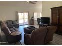 Comfortable living room area with neutral tones and sliding doors to outdoor area at 2723 E Rockledge Rd, Phoenix, AZ 85048