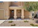 Inviting front porch area with desert landscaping and elegant entry door at 3025 E Fremont Rd, Phoenix, AZ 85042