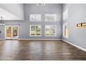 Spacious living room with ample natural light and wood-look flooring at 3025 E Fremont Rd, Phoenix, AZ 85042