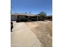 Single level brick home with attached garage and dry landscaping in need of renovation at 3701 W Keim Dr, Phoenix, AZ 85019