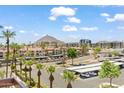 Elevated view showcases community buildings, palm trees, and Camelback Mountain at 4200 N Miller Rd # 504, Scottsdale, AZ 85251
