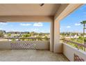 Open balcony with tile flooring and patterned dividers overlooking a serene cityscape at 4200 N Miller Rd # 504, Scottsdale, AZ 85251