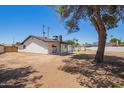 Large backyard with ample space for outdoor activities and a covered patio at 4701 N 63Rd Dr, Phoenix, AZ 85033