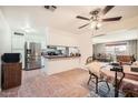 Bright kitchen features stainless steel appliances, a breakfast bar, and a dining area with tile flooring at 5343 W Coronado Rd, Phoenix, AZ 85035