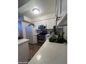 Well-lit kitchen featuring white cabinets and stainless steel appliances at 602 N May St # 65, Mesa, AZ 85201