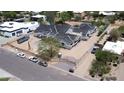 A construction project shows a multi-unit building with gray roofs and light siding surrounded by cars and fencing at 6426 E Turquoise Ave, Paradise Valley, AZ 85253