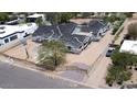 A construction project shows a multi-unit building with gray roofs and light siding surrounded by fencing at 6426 E Turquoise Ave, Paradise Valley, AZ 85253