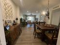 Open living space featuring stylish decor, plants, and seamless flow to the dining area at 12421 N 41St Pl, Phoenix, AZ 85032