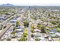 Expansive aerial view of the neighborhood showcasing tree-lined streets and a mix of residential and commercial properties at 1274 E Edgemont Ave, Phoenix, AZ 85006