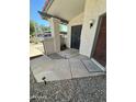 Inviting front porch with stylish stone, secure wrought iron door, and solar lighting at 1718 S Longmore St # 53, Mesa, AZ 85202