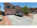 Charming two-story home features a well-manicured front yard and a spacious driveway at 19719 N Castille Dr, Maricopa, AZ 85138