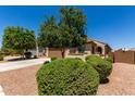 Single-story home featuring a two-car garage, desert landscaping, and a neutral color scheme at 20128 W Jackson St, Buckeye, AZ 85326