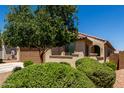 Single-story home featuring a two-car garage, desert landscaping, and a neutral color scheme at 20128 W Jackson St, Buckeye, AZ 85326