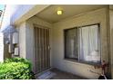 Cozy home entryway featuring a security door and a bright window, enhancing curb appeal at 2416 W Caribbean Ln # 2, Phoenix, AZ 85023