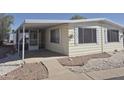 This home boasts a screened porch and low maintenance yard at 3104 E Broadway Rd # 268, Mesa, AZ 85204