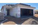 The construction of a single-Gathering home progresses, showing an unfinished roof and garage at 32030 N Pony Express Rd, San Tan Valley, AZ 85143