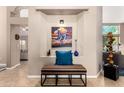 Welcoming entryway with tiled floors, a decorative niche, and stylish furnishings at 3535 E Brookwood Ct, Phoenix, AZ 85048