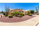 Well-maintained single-story home featuring desert landscaping and a charming fence at 3535 E Brookwood Ct, Phoenix, AZ 85048