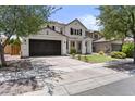 Charming two-story house featuring a well-maintained lawn and a spacious driveway at 3575 E Gary Way, Gilbert, AZ 85234