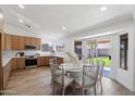 Eat-in kitchen boasts updated countertops, stainless steel appliances, and a sliding glass door leading to the backyard at 4439 W Cielo Grande --, Glendale, AZ 85310