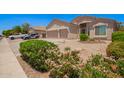 A charming home with a well-manicured desert landscaped front yard in a quiet neighborhood at 9142 W Pontiac Dr, Peoria, AZ 85382