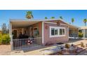 Charming home featuring covered parking and a well-maintained desert-style landscaped front yard at 9302 E Broadway Rd # 122, Mesa, AZ 85208