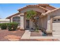 Inviting front entrance with desert landscaping, security door, and tile walkway at 1030 S Brentwood Ct, Chandler, AZ 85286