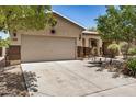 Spacious single-story home with a large driveway and well-kept desert landscaping at 1086 E Canyon Trail --, San Tan Valley, AZ 85143