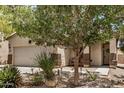 Inviting single-story home with desert landscaping, featuring a comfortable bench on the porch at 1086 E Canyon Trail --, San Tan Valley, AZ 85143