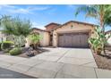 Beautiful home with a well-manicured yard and a two-car garage at 119 E Camellia Way, San Tan Valley, AZ 85140