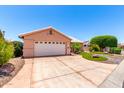 Attractive single-story home featuring a well-kept front yard with vibrant landscaping at 15073 W Piccadilly Rd, Goodyear, AZ 85395