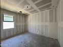 Unfinished bedroom shows drywall and a window at 15789 W Beryl Ave, Waddell, AZ 85355