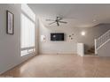 Bright living room featuring tile floors, neutral paint, and staircase, creating a welcoming atmosphere at 1851 W Vermont Ave, Phoenix, AZ 85015