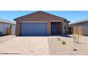 Charming single-story home featuring a blue garage door and modern architectural details at 4195 W Lisa Ln, San Tan Valley, AZ 85144
