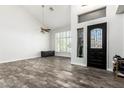 Bright entryway with decorative door, elegant tile floors, and ample natural light from the large window at 4530 E Decatur St, Mesa, AZ 85205