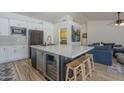Modern kitchen with a large center island, stainless steel appliances, and sleek cabinetry at 5919 W Blackhawk Dr, Glendale, AZ 85308