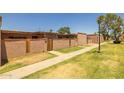 Neighborhood exterior view with grass and walkway at 6008 W Augusta Ave, Glendale, AZ 85301