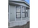 Close-up of the front exterior with a bay window at 730 S Country Club Dr # 62, Mesa, AZ 85210