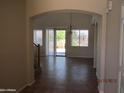 View of entryway with tile flooring, archway, and lots of natural light at 9018 W Superior Ave, Tolleson, AZ 85353