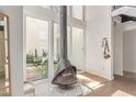 Bright living room showcasing modern fireplace, large windows, and seamless access to a private outdoor patio at 930 S Dobson Rd # 3, Mesa, AZ 85202
