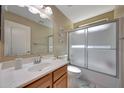Well-lit bathroom with a single sink vanity and a shower-tub combination at 9926 W Gross Ave, Tolleson, AZ 85353